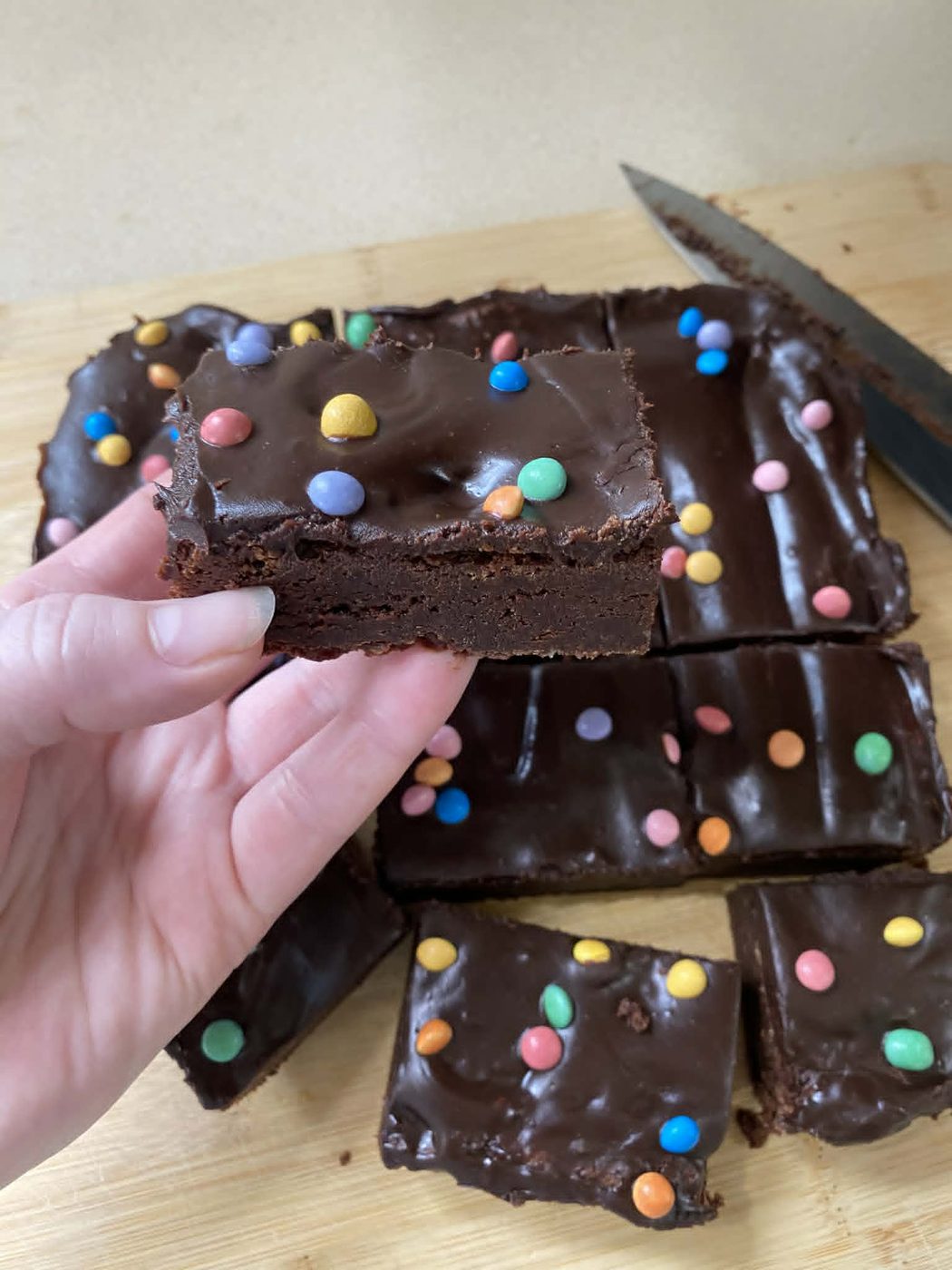 Fudgy chocolate brownie with rainbow candy chips on top